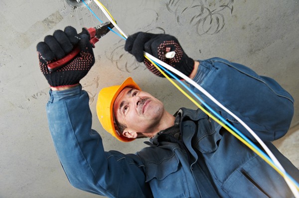Electrician at wiring work